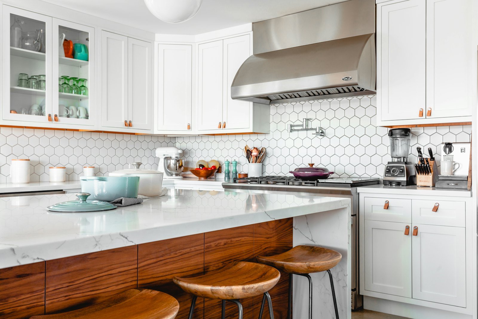 A bright Naples style kitchen with white cabinetry and lots of natural light